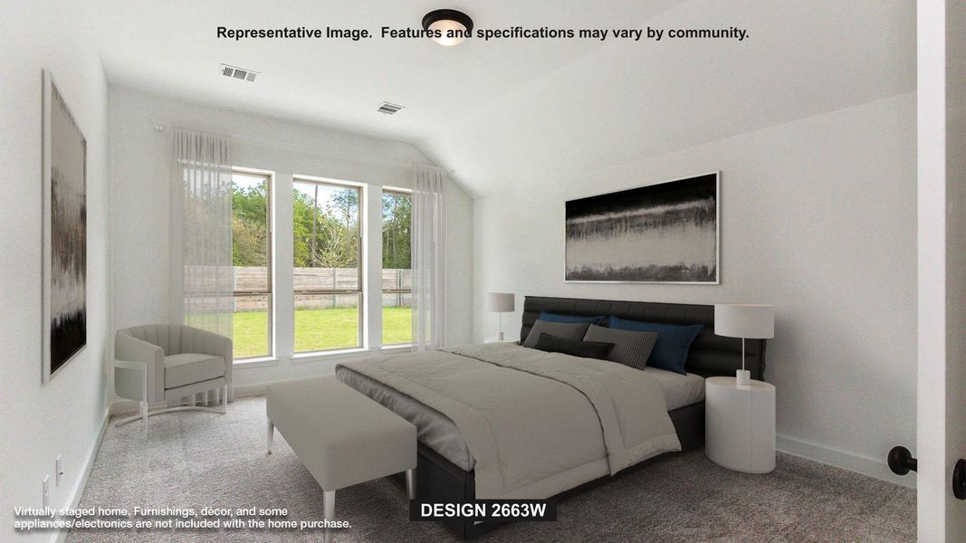 Bedroom featuring lofted ceiling and carpet