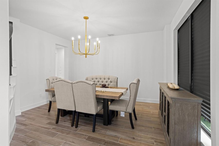 Formal dining room with elegant lighting