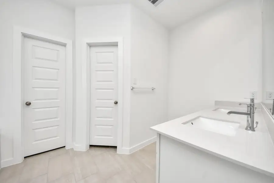 Escape to a spa-like oasis in this primary bathroom. Enjoy a walk-in shower with tile surround, a separate garden tub with custom detailing, and an elegant vanity featuring light countertops, modern hardware, and beautiful recessed lights. Experience luxury and relaxation in every detail. Sample photo of completed home with similar floor plan. Actual colors and selections may vary. Escape to a spa-like oasis in this primary bathroom. Enjoy a walk-in shower with tile surround, a separate garden tub with custom detailing, and an elegant vanity featuring light countertops, modern hardware, and beautiful recessed lights. Experience luxury and relaxation in every detail. Sample photo of completed home with similar floor plan. Actual colors and selections may vary.