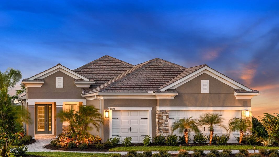 Front exterior of a new home in Grand Park Real Estate and Homes for Sale in Sarasota, FL - Neal Communities, Sarasota, FL, highlighting curb appeal (Image 25). Front exterior of a new home in Grand Park Real Estate and Homes for Sale in Sarasota, FL - Neal Communities, Sarasota, FL, highlighting curb appeal (Image 25).