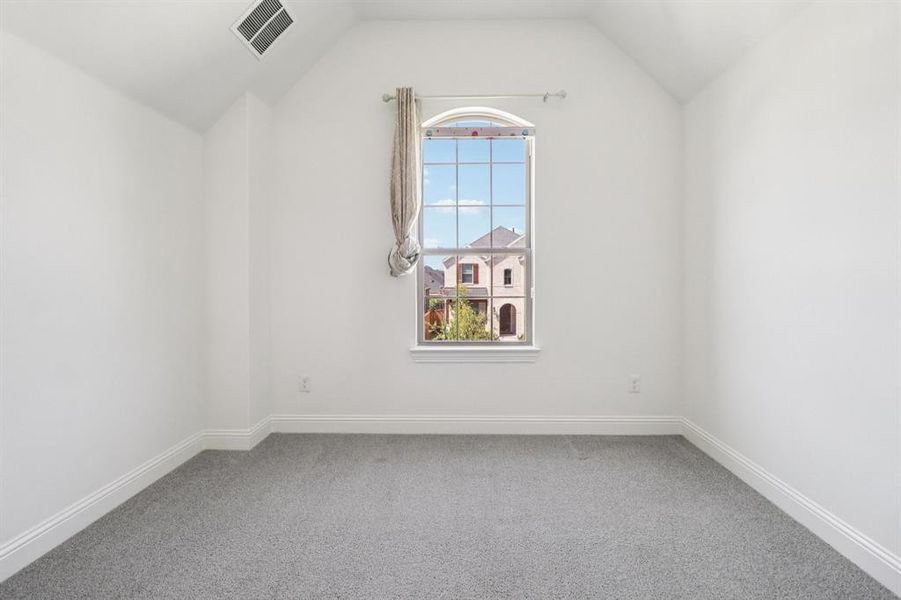 Bonus room featuring carpet floors and lofted ceiling Bonus room featuring carpet floors and lofted ceiling