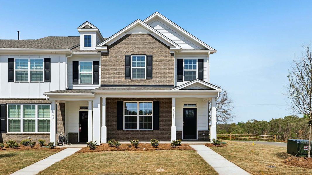 Front exterior of a new home in Sanctuary at Southgate, Indian Trail, NC, highlighting curb appeal (Image 1). Front exterior of a new home in Sanctuary at Southgate, Indian Trail, NC, highlighting curb appeal (Image 1).
