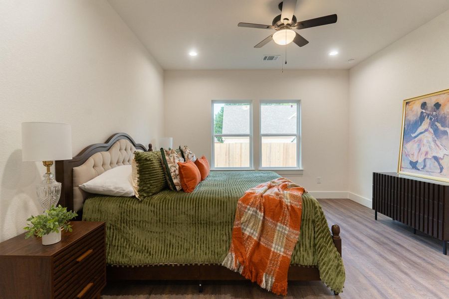 Bedroom with wood finished floors, baseboards, recessed lighting, and a ceiling fan