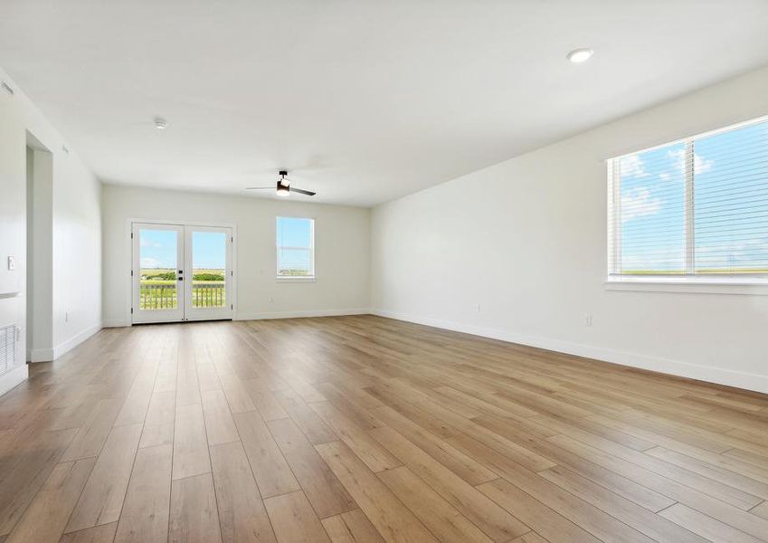 The family room has large windows that let in great, natural light.