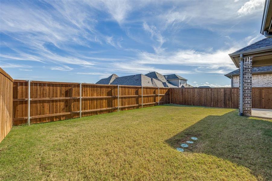 View of fenced backyard