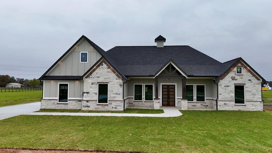 Front exterior of a new home in , Angleton, TX, highlighting curb appeal (Image 1). Front exterior of a new home in , Angleton, TX, highlighting curb appeal (Image 1).