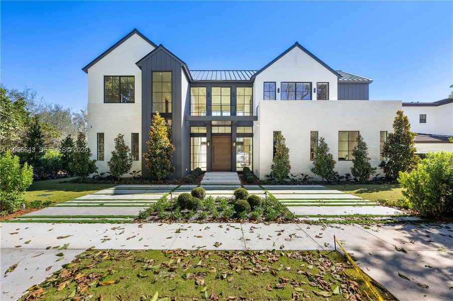 Front exterior of a new home in , Miami, FL, highlighting curb appeal (Image 1). Front exterior of a new home in , Miami, FL, highlighting curb appeal (Image 1).