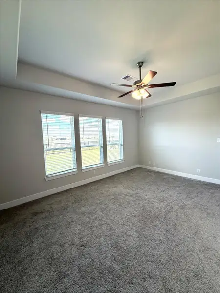 Serene primary retreat overlooking the backyard & beautiful pond!