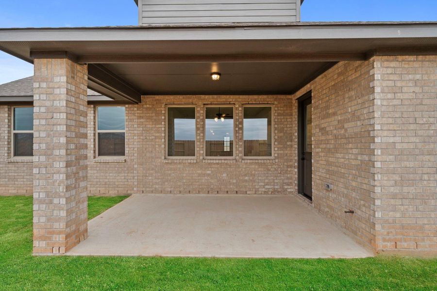 Generously sized covered patio allows for ample room for your grill and patio furniture.