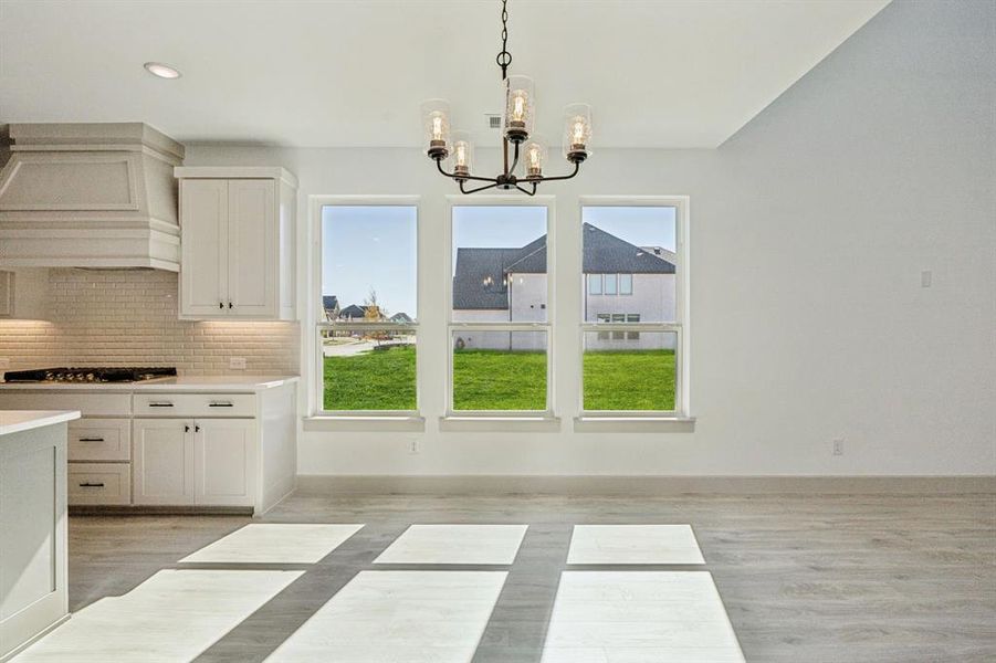 This light filled dining room is the perfect place to host family and friends. This light filled dining room is the perfect place to host family and friends.