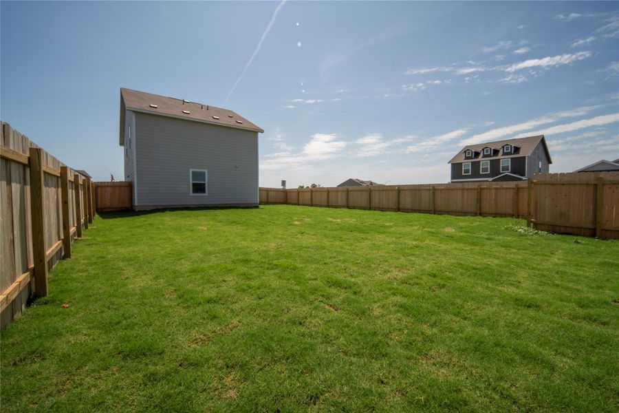 View of fenced backyard