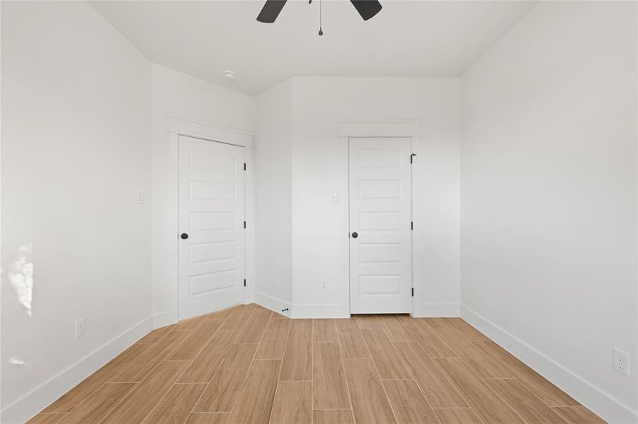 Owner room featuring coffered ceiling, beam ceiling, wood finish floors, a ceiling fan, and recessed lighting