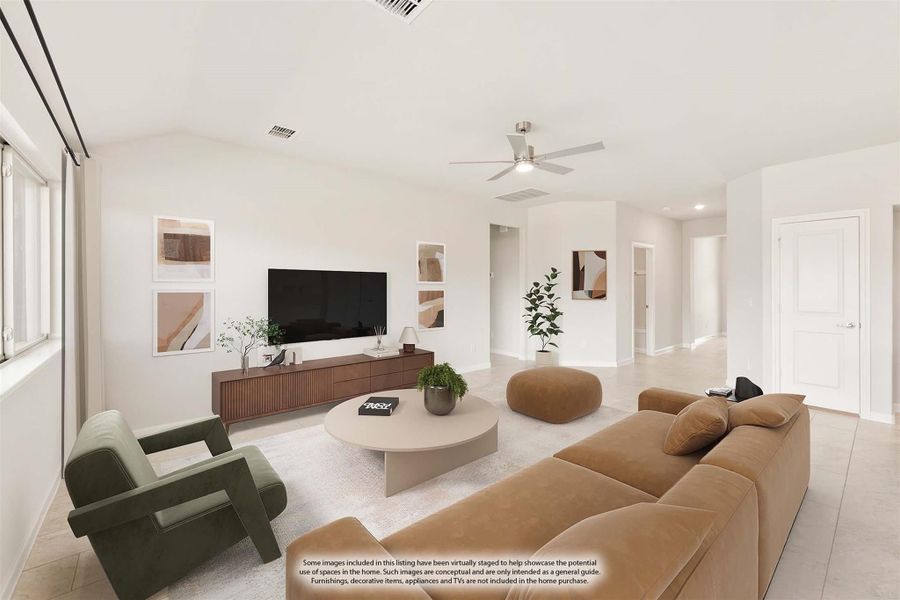 Open living room with ceiling fan, tan sofa, green chair, and wall-mounted TV on wood media console