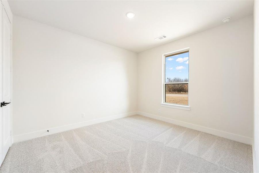Unfurnished room featuring light colored carpet and recessed lighting
