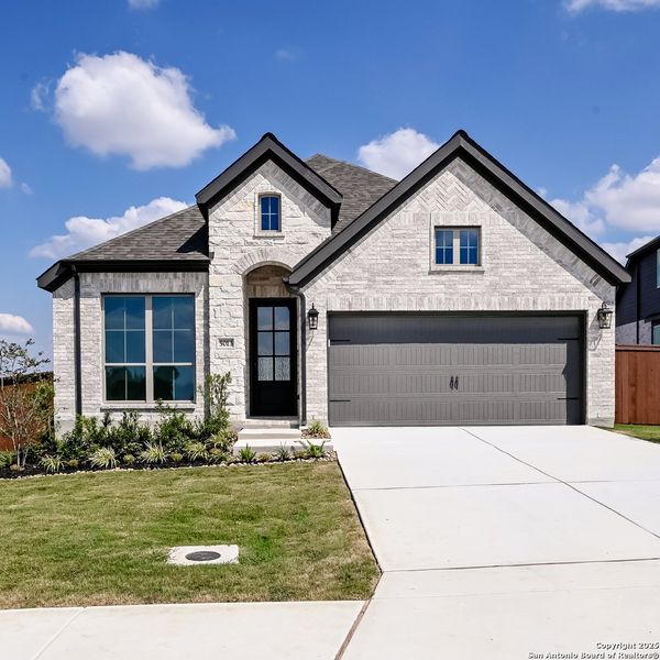 Front exterior of a new home in Homestead 55', Cibolo, TX, highlighting curb appeal (Image 1).