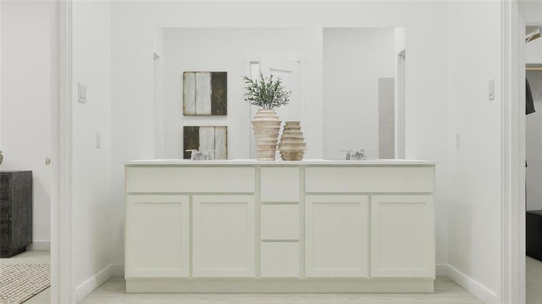 Full bath featuring double vanity and light wood finished floors Full bath featuring double vanity and light wood finished floors