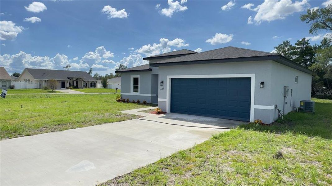 Front exterior of a new home in , Ocala, FL, highlighting curb appeal (Image 14). Front exterior of a new home in , Ocala, FL, highlighting curb appeal (Image 14).