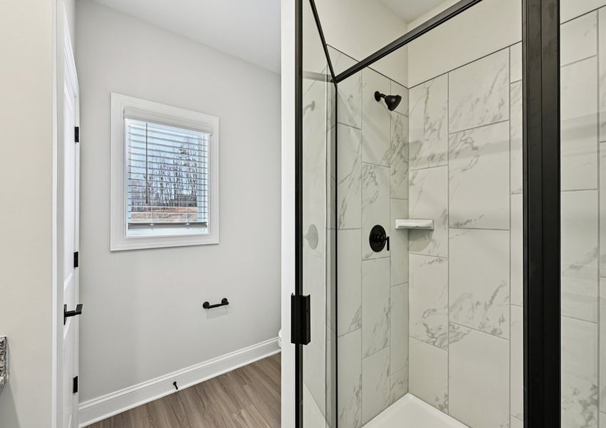 The master bathroom showcases this beautiful, glass-enclosure shower The master bathroom showcases this beautiful, glass-enclosure shower