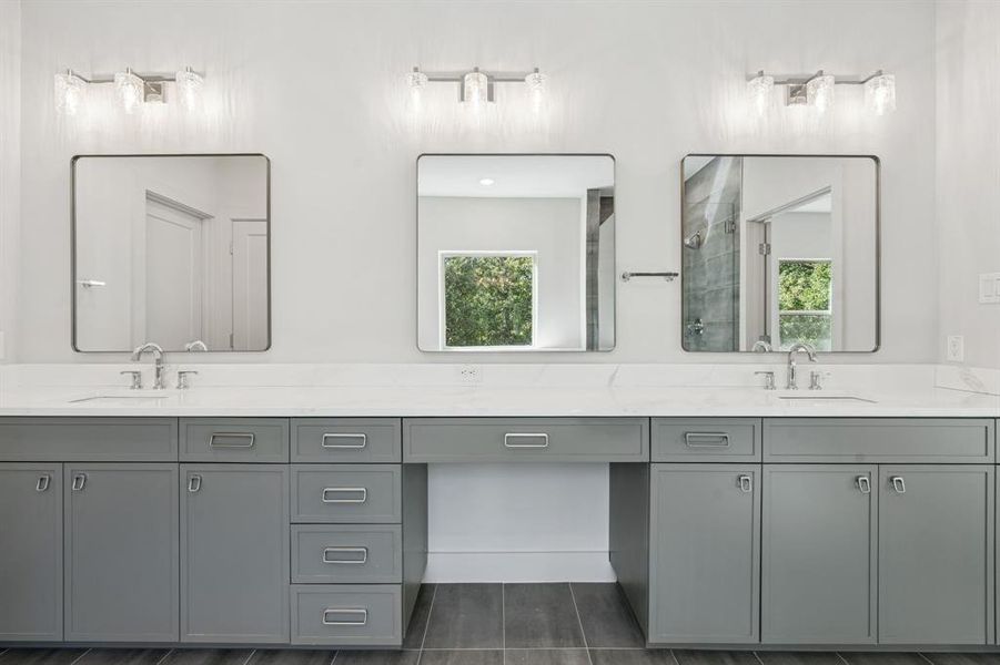 Vanity area with decorative lighting and mirrors.