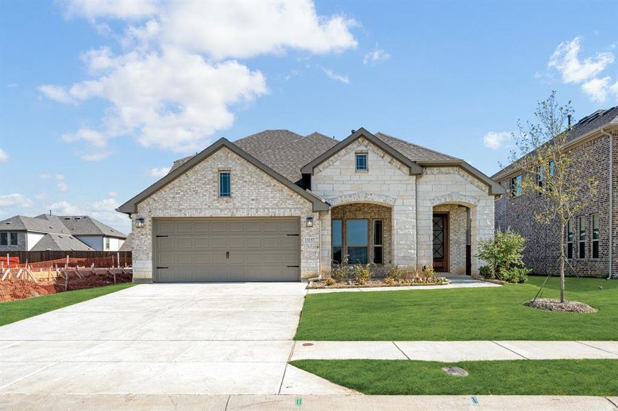Front exterior of a new home in Woodstone, Providence Village, TX, highlighting curb appeal (Image 20). Front exterior of a new home in Woodstone, Providence Village, TX, highlighting curb appeal (Image 20).