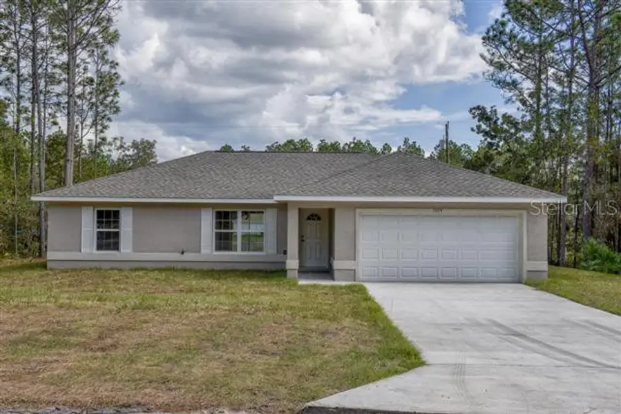 Front exterior of a new home in , Ocala, FL, highlighting curb appeal (Image 1). Front exterior of a new home in , Ocala, FL, highlighting curb appeal (Image 1).