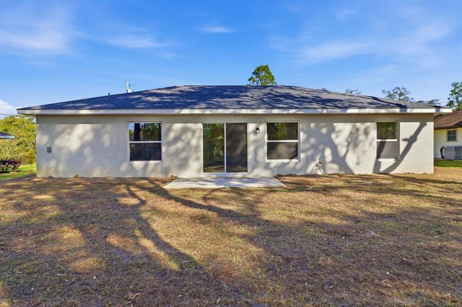 Exterior details and patio area of a home in , Citrus Springs (Image 3).