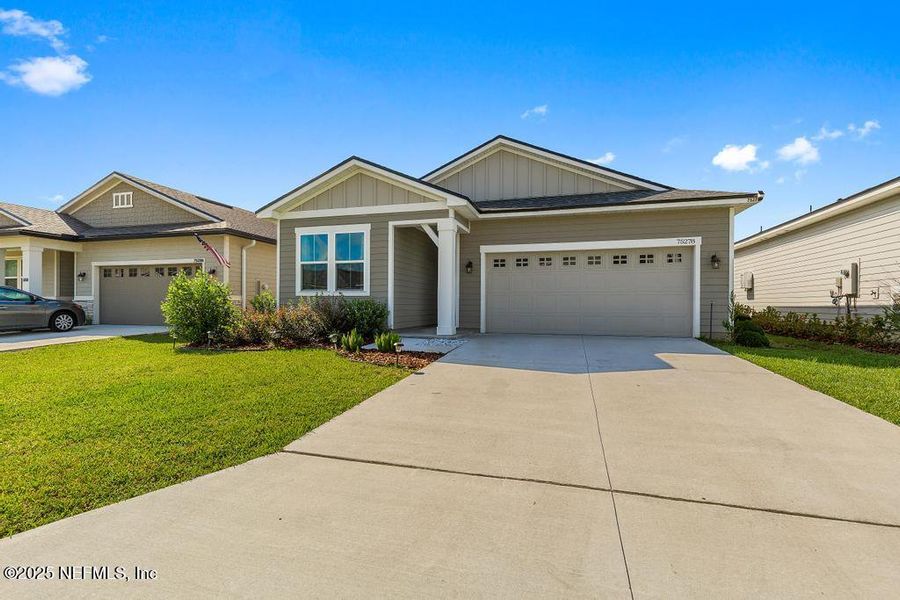 Front exterior of a new home in , Yulee, FL, highlighting curb appeal (Image 23). Front exterior of a new home in , Yulee, FL, highlighting curb appeal (Image 23).