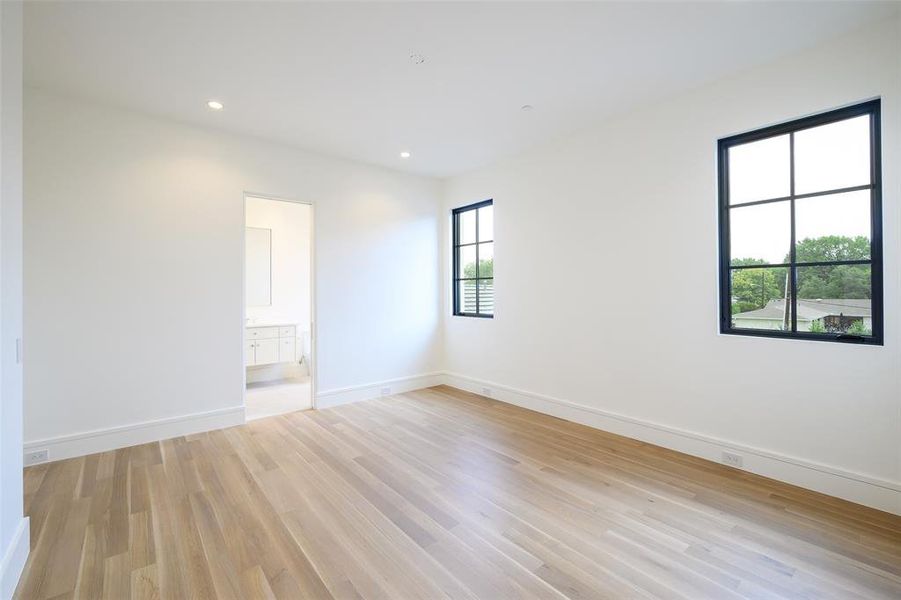 Unfurnished room featuring light wood-style flooring and recessed lighting Unfurnished room featuring light wood-style flooring and recessed lighting