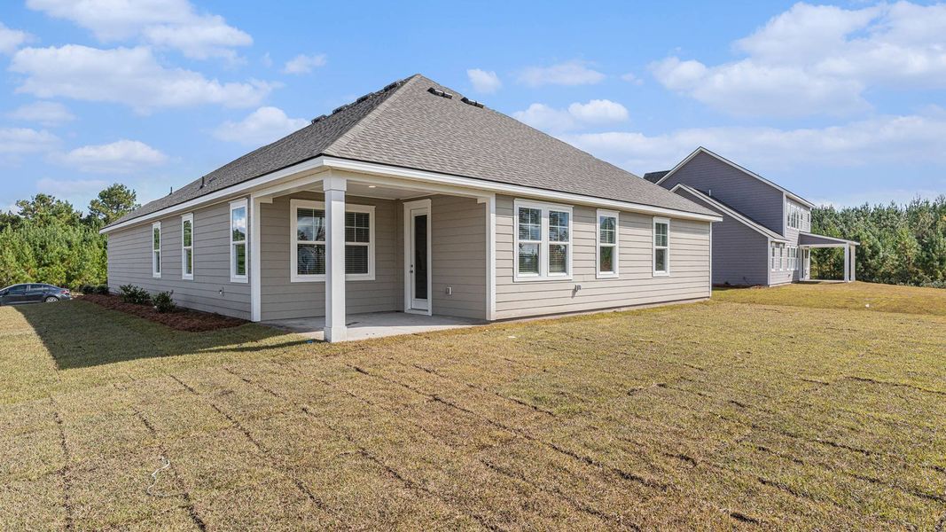 Exterior details and patio area of a home in Cedar Hill Landing, Navassa (Image 3).
