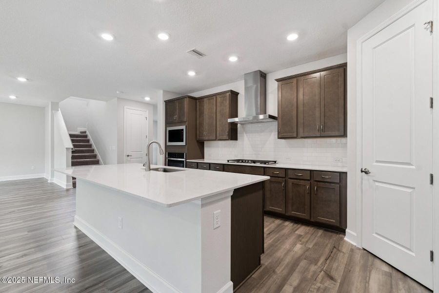 Furnished interior view inside a new home in Tributary 70', Yulee (Image 6).