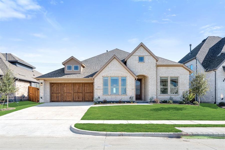 Front exterior of a new home in Sonoma Verde, McLendon-Chisholm, TX, highlighting curb appeal (Image 2).