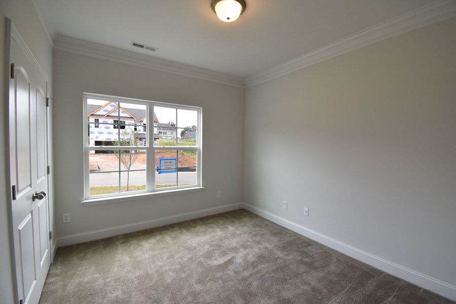 Representative unfurnished interior of a home built from the Ellerbe by Keystone Homes NC in Sullivans Reserve, Walkertown (Image 37).