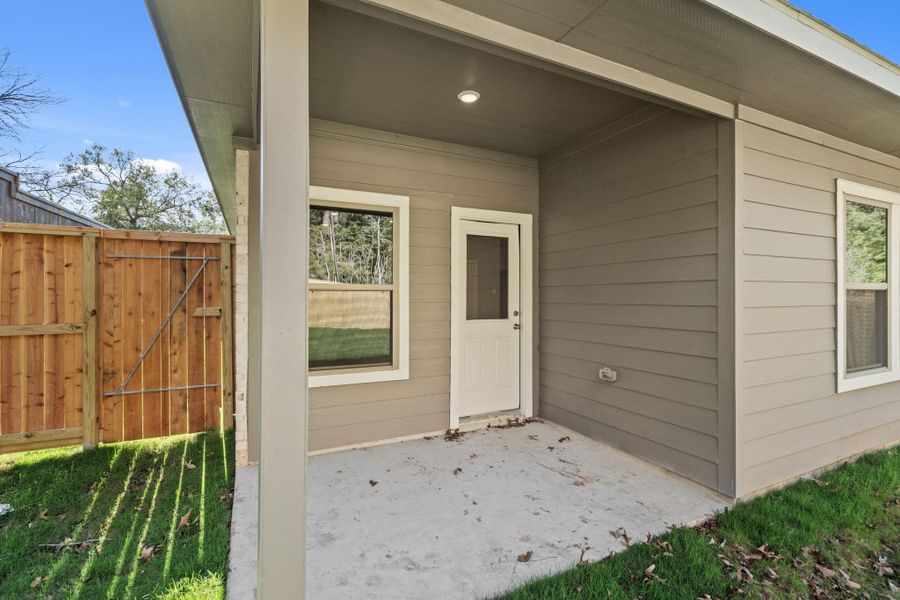 Exterior details and patio area of a home in , Conroe (Image 24).