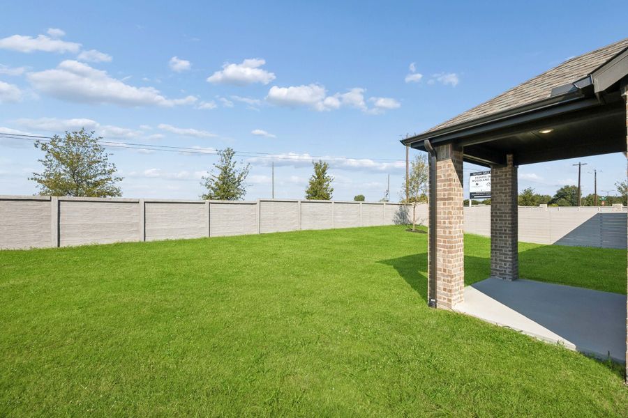 Exterior details and patio area of a home in Painted Tree Woodland West, McKinney (Image 20).
