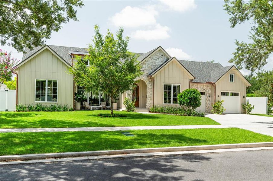Front exterior of a new home in , Orlando, FL, highlighting curb appeal (Image 21). Front exterior of a new home in , Orlando, FL, highlighting curb appeal (Image 21).