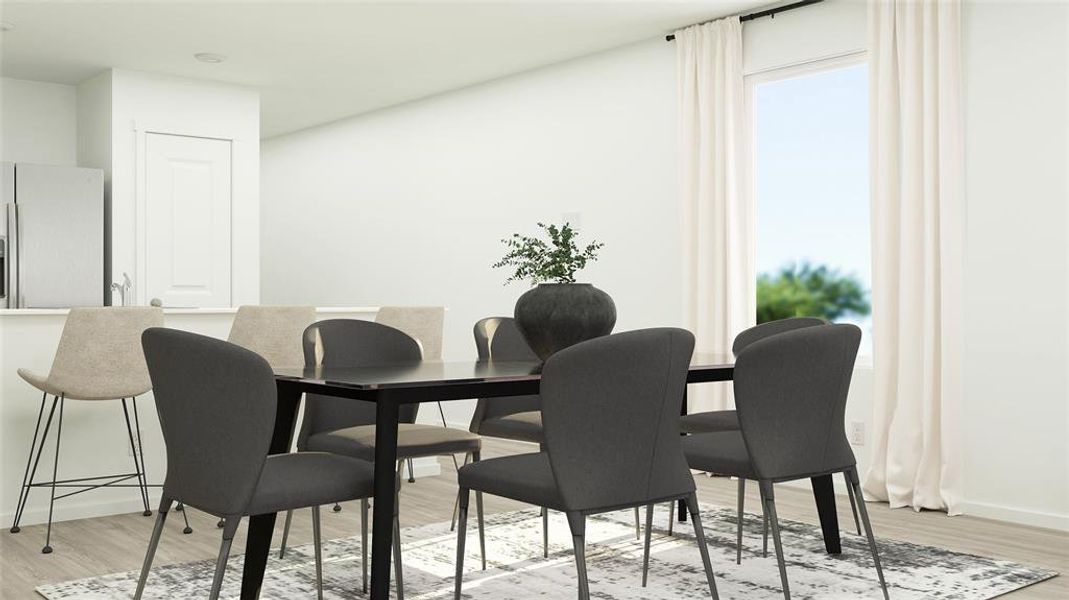 Dining area with light hardwood / wood-style floors