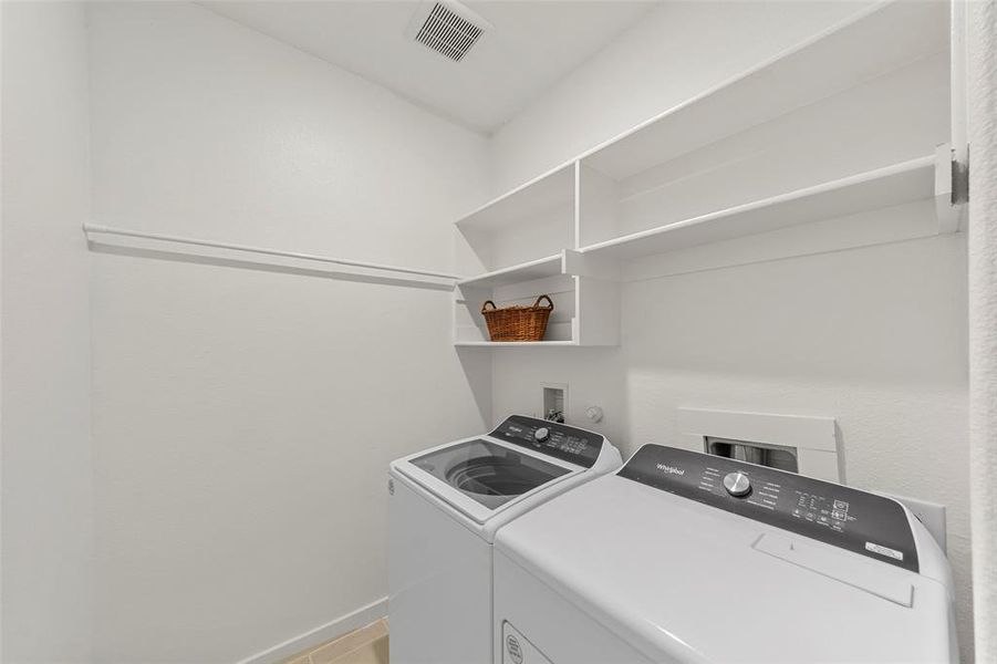 Separate laundry room with shelving. Separate laundry room with shelving.