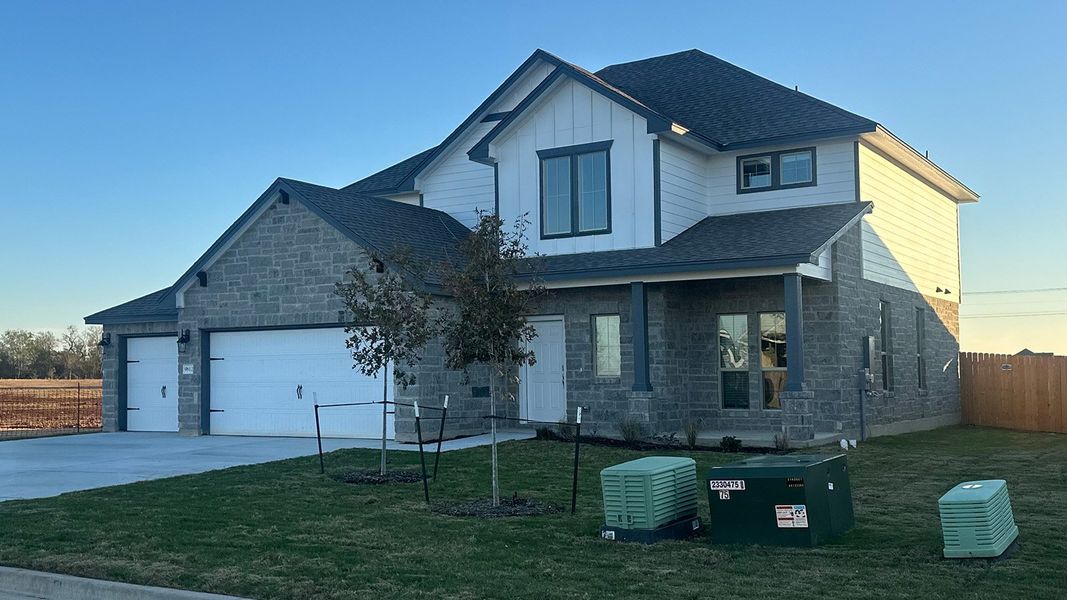 Front exterior of a new home in Saddle Creek, Waco, TX, highlighting curb appeal (Image 2).