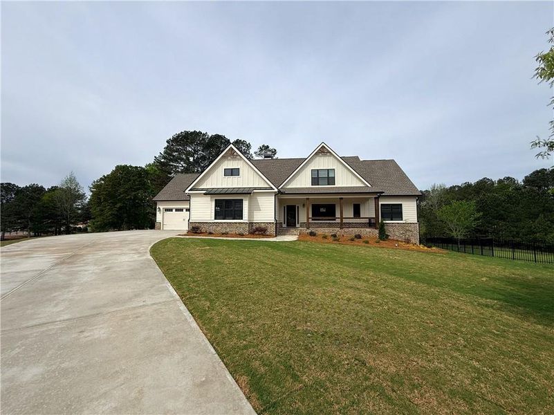 Front exterior of a new home in Stonegate, Monroe, GA, highlighting curb appeal (Image 1). Front exterior of a new home in Stonegate, Monroe, GA, highlighting curb appeal (Image 1).