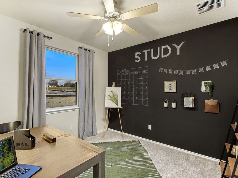 Santiago model downstairs bedroom at Hidden Springs in New Braunfels, TX by Century Communities