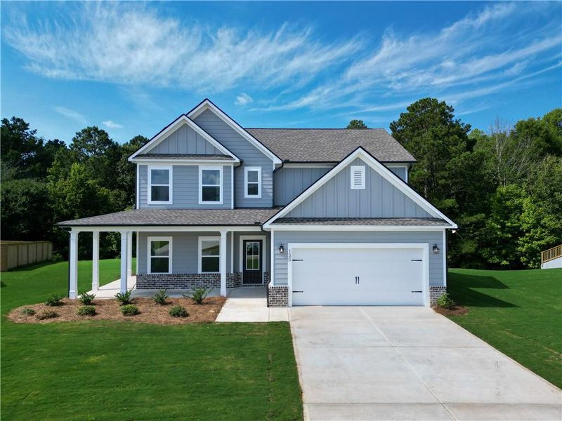 Front exterior of a new home in Harmony Farms, Eatonton, GA, highlighting curb appeal (Image 26). Front exterior of a new home in Harmony Farms, Eatonton, GA, highlighting curb appeal (Image 26).