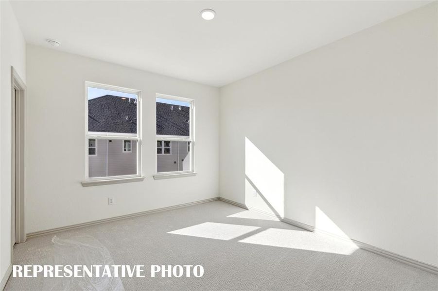 One of two nicely sized secondary bedrooms offered in our Wyatt floor plan.  REPRESENTATIVE PHOTO