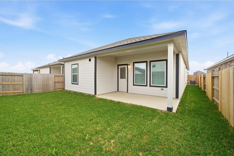 Exterior details and patio area of a home in Windrose Green, Angleton (Image 2).