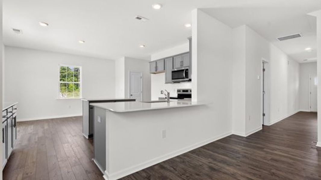 Furnished interior view inside a new home in Shahbain Reserve, Raeford (Image 4).