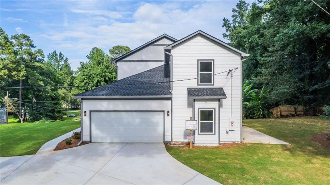 Front exterior of a new home in , Lithonia, GA, highlighting curb appeal (Image 23).
