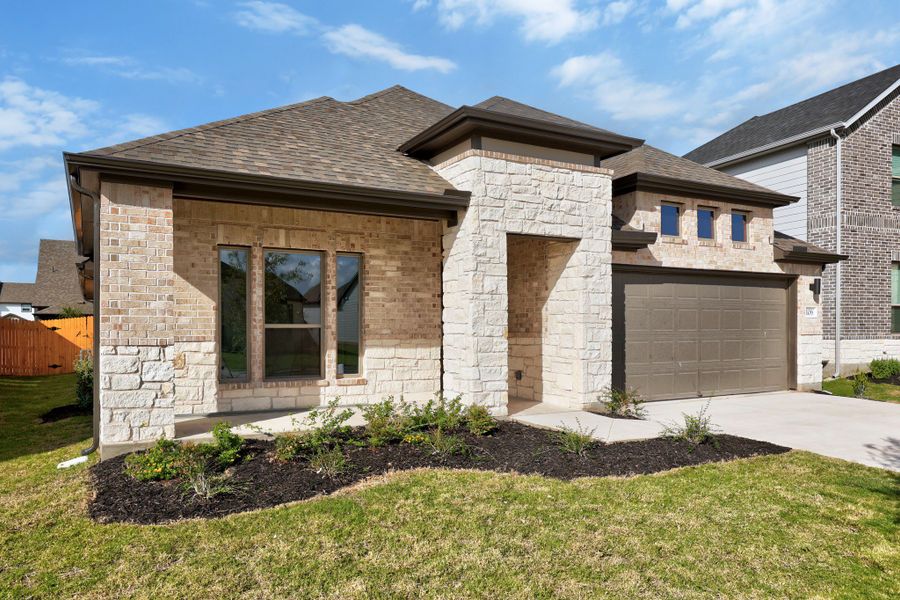Front exterior of a new home in Prairie Winds, Hutto, TX, highlighting curb appeal (Image 21).