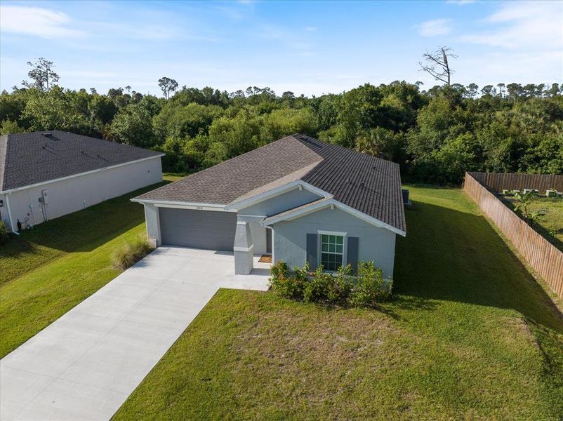 Front exterior of a new home in New Homes in Port Charlotte, Port Charlotte, FL, highlighting curb appeal (Image 20).