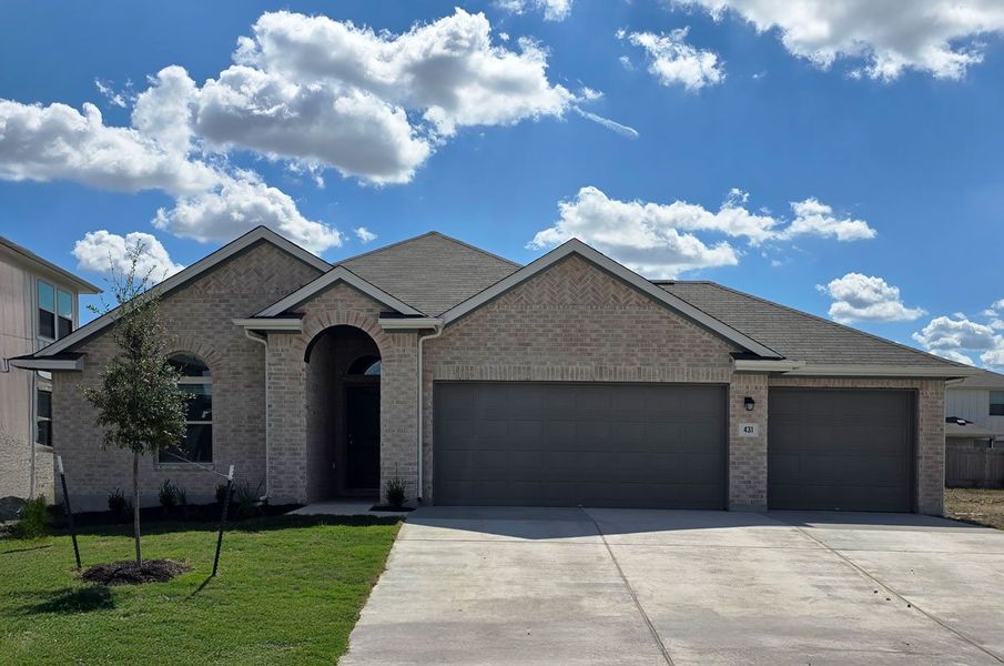 Front exterior of a new home in Crosswinds, Kyle, TX, highlighting curb appeal (Image 1).