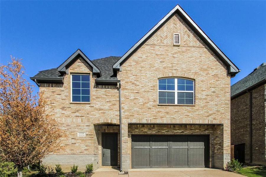 View of front of home featuring a garage