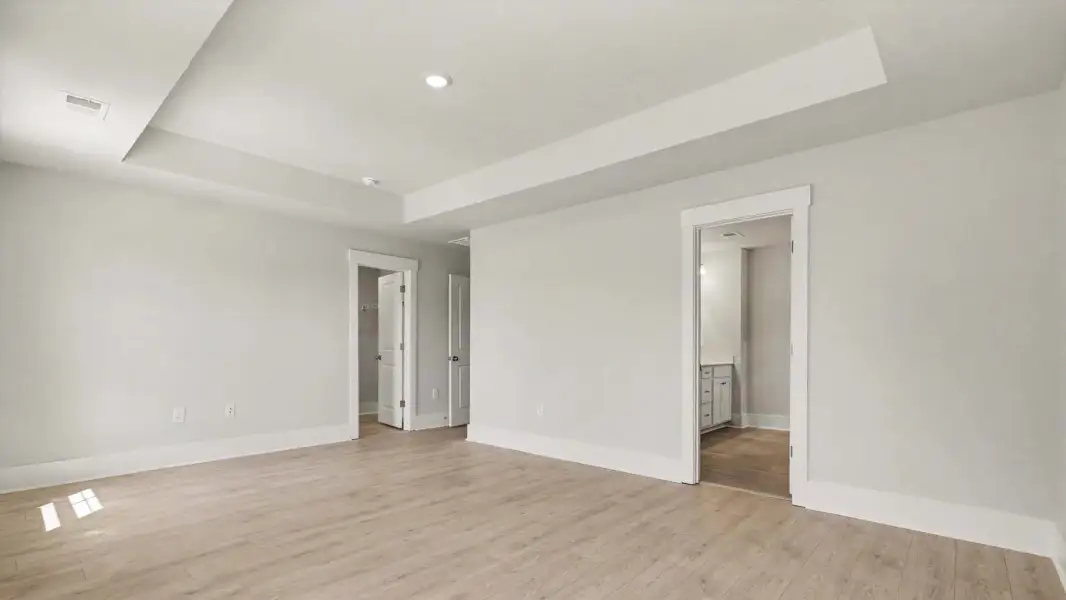 Representative unfurnished interior of a home built from the Woodstock by D.R. Horton in Riverlake, Supply (Image 9).